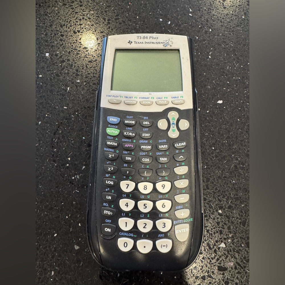 Texas Instruments TI-84 Plus Graphing Calculator in Cream and Black